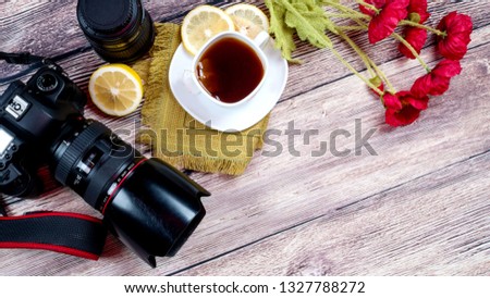 Professional digital camera on a wooden background