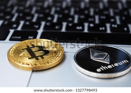 Ethereum and Bitcoin currency, money on computer laptop keyboard. Bussiness, commercial, Exchange.