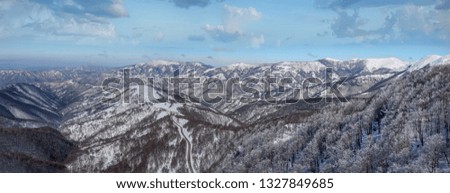 Panoramic view of snow mountains.Austrian alps panorama.Snowy hill peak.