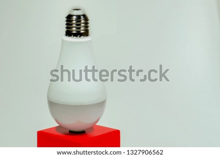 Light bulb on red stand