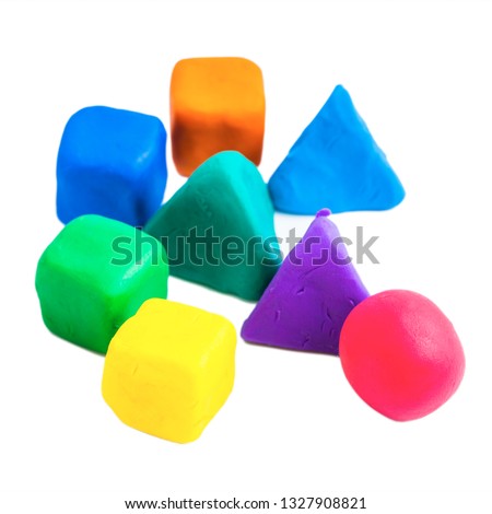 Pyramids, cubes and balls made with colorful plasticine,  on the white background
