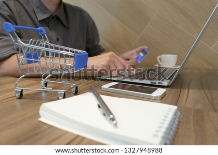 ฺBoys are buying products online by paying via credit cards, online shopping and technology concept