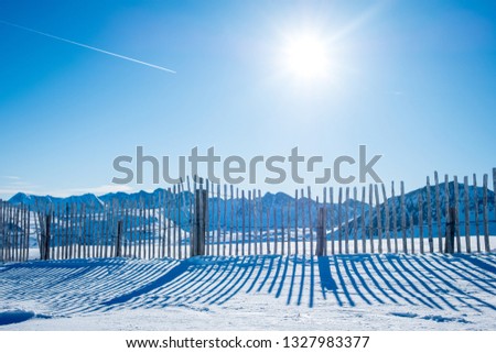 Reflection of the fence in the sun in the mountains. Andorra GrandValira Ski. Pyrenees Mountains