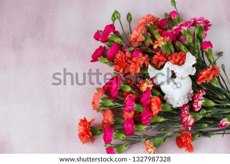 bright carnations on a pink background and two white doves - wedding background