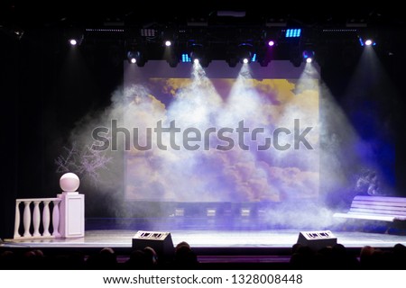 Theatrical scene without actors, scenic light and smoke