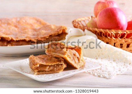 Glazed apple pie squares served on wooden table