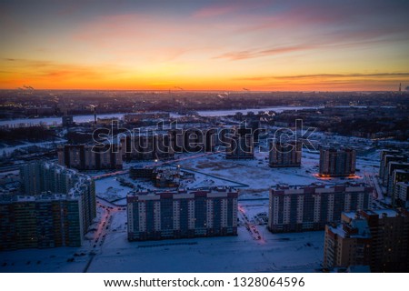 Aerial drone footage of last minutes of sunset over the city. Golden sky of Saint Petersburg. 