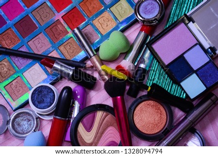 Colorful makeup background, objects, vivid, glitter, pink, fashion, glam, 80s cosmetics, carnival, beatuy, vanity, lipstick, eyeshadow, blush, mascara, 