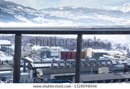 The Égratz Viaduct, a curved concrete box girder bridge in south-east France, in the French Alps, near Switzerland and Italy shot in the winter with snow and mist. 