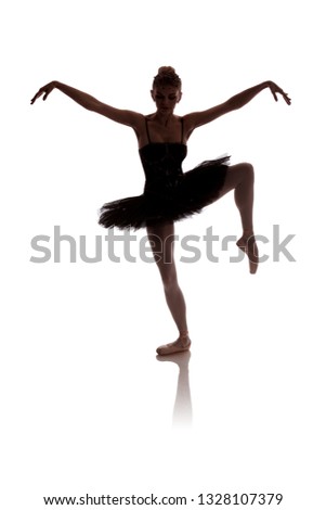 woman ballerina in black tutu posing on white background
photo made in the style of "low key"