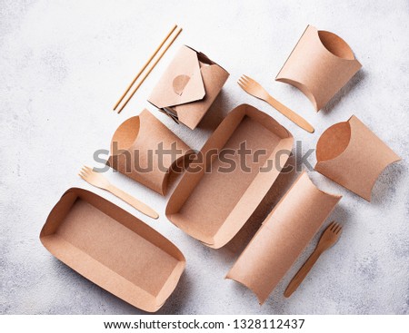 Eco friendly fast food containers from paper. Top view Royalty-Free Stock Photo #1328112437