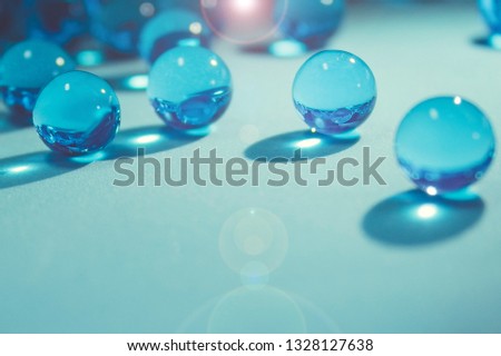  Blue gel. Hydrogel round shape on clean white background. Macro balls on smooth surface. Concept purity and minimalism. Classic cold abstract holiday wallpaper