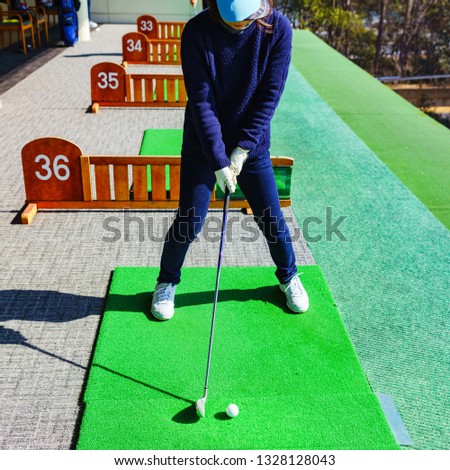 japanese woman is playing golf lesson