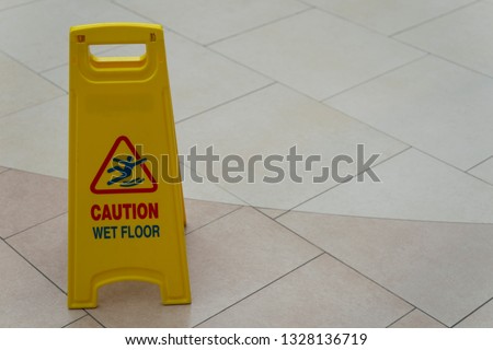 Safety sign with phrase caution wet floor Cleaning service
