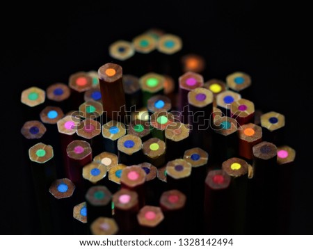 colorful pencils on black background
