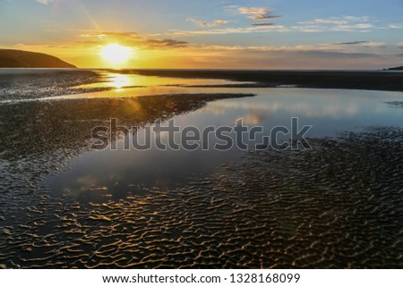 Sunset at Poppit Beach Pembrokeshire Royalty-Free Stock Photo #1328168099