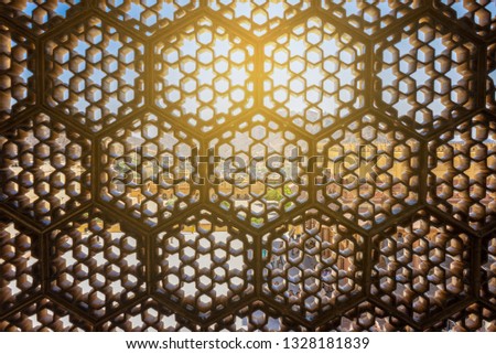 Detail of perforated wall of Ganesh Pol in the south side of the courtyard of the palace in the Amber Fort. Constructed of red sandstone and marble. Jaipur, Rajasthan, India