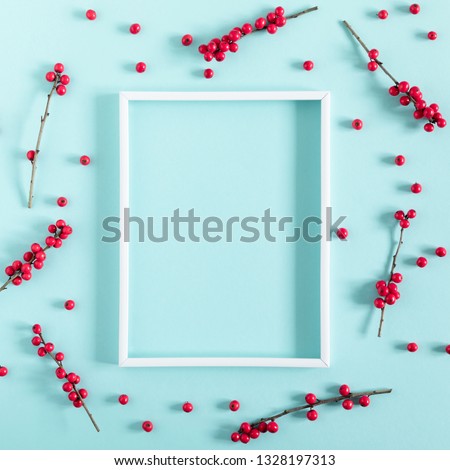 Berries composition. Photo frame, red berries on pastel pink background. Flat lay, top view, copy space 