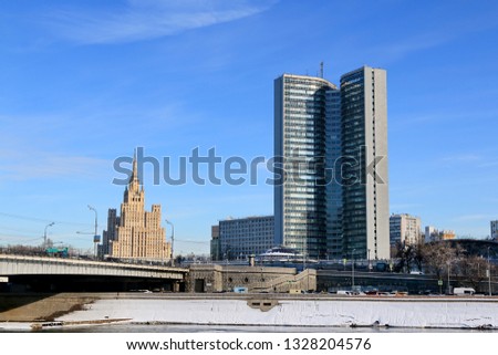 Moscow, Russia - February 14, 2019: Smolenskaya Embankment of the Moscow River. On the left is a high-rise building on Kudrinskaya Square. On the right is a building owned by the government of Moscow