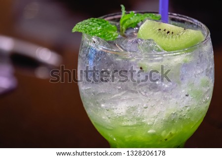 Green kiwi Italian Soda Cold Beverage and Kiwi Fruit and mint leave