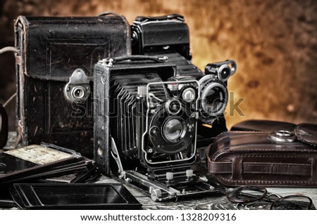 Old photo devices on the old background.