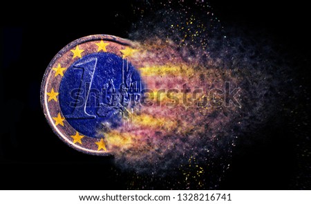 one euro coin explosion isolated close up Royalty-Free Stock Photo #1328216741