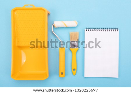 Paint tools. Paint brush and roller with tray for paint