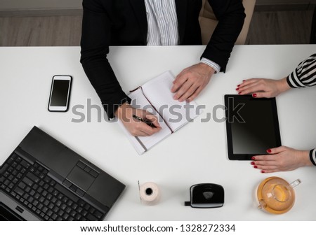 Close up hands of business people working with documents in the office 