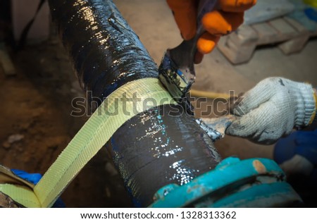 Water supply system. Refinery. Old pipeline. Composite repair using ceramic resin and kevlar. Picture taken in Ukraine, Kiev region. Color image