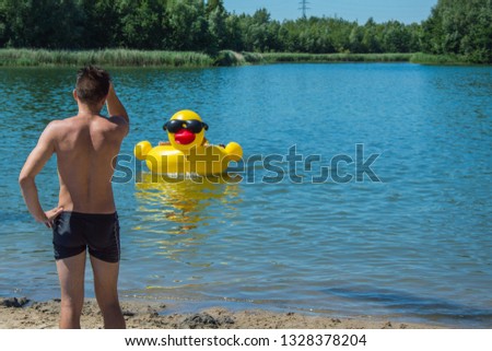 inflatable duck on the water, summer holiday concept
