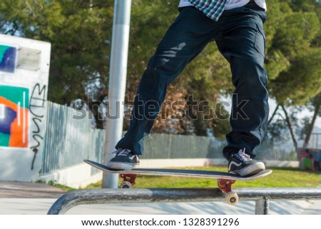 Skateboarder skateboarding on skatepark