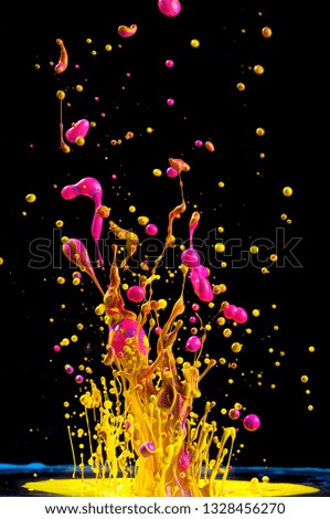 Dancing colored paint. Abstract sculpture dye. Splash of ink on a black background
