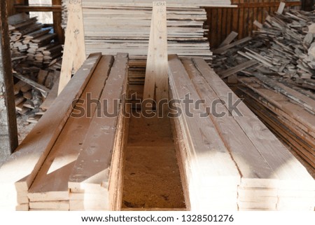 Timber at work. Lumber stockpiled. The boards are stacked. Boards for sale in stock. Lumber.