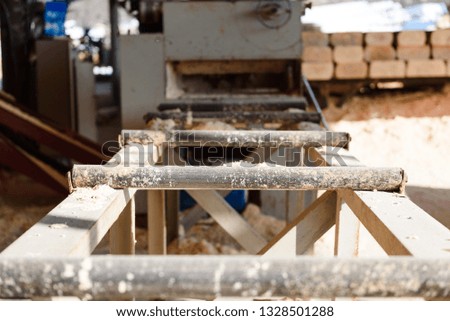 Machine for cutting wood on the boards. Sawmill. production of boards. Wood processing factory. sawing wood.