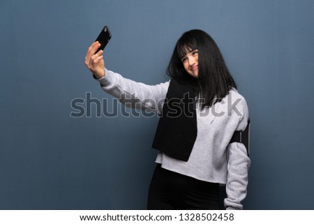 Young sport woman making a selfie