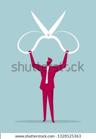 Businessman lifts huge scissors. Isolated on blue background.