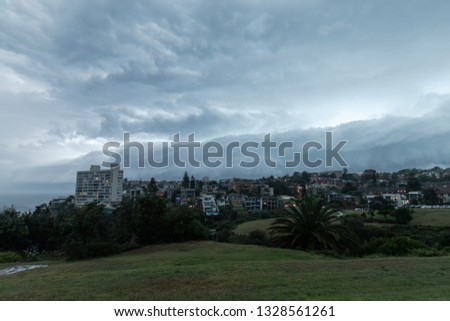 Storm clouds forming on top of coastline suburb at Sydney, Australia.