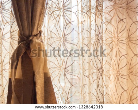 Brown sunlit curtain with free space