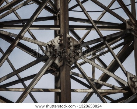 Fragment of the high-voltage tower. Power line. Metalware. Urban grunge. Abstract background
