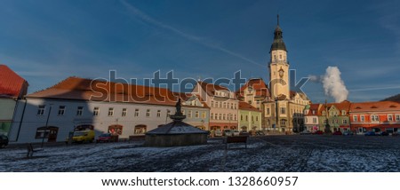 Sunny cold winter morning on main old square in Bilina town in north Bohemia Royalty-Free Stock Photo #1328660957
