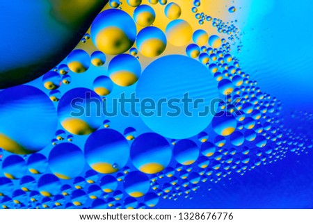 Abstract background with colorful gradient colors. Oil drops in water abstract psychedelic pattern image. Blue colored abstract pattern