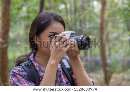 Picture of photographer asian woman taking a photos with dslr camera professional photography during her vacation, Concept of woman solo travel
