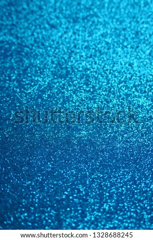 Glitter  wallpaper.  Glitter blue iridescent macro background with stars. Shiny backdrop.Snowy blue glitter shiny  abstract Background.

