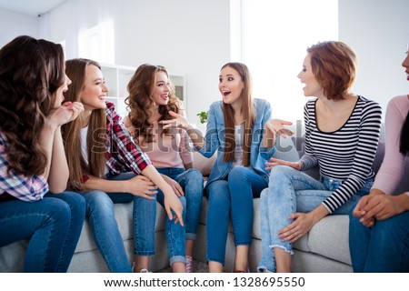 Portrait of her she nice girlish lovely attractive pretty cheerful cheery talkative ladies sitting on divan having fun talking discussing rumour get-together in light white interior room indoors Royalty-Free Stock Photo #1328695550