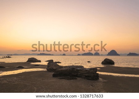 Tup Kaek beach close to Kwang beach and non Nak mountain during low tide 
can see long and large beach can walk around many big rocks on the beach 
beautiful sunset behind archipelago in Andaman sea