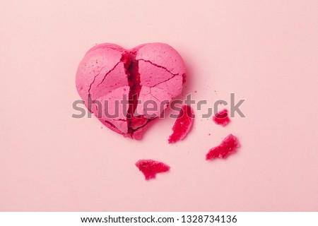 broken heart isolated on pink background, divorce, depression and breakup concept, crying, medical cardiovascular health care problems Royalty-Free Stock Photo #1328734136