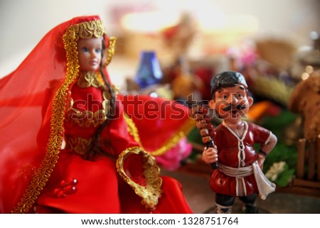 Traditional Caucasus dress on a female doll. Novruz holiday