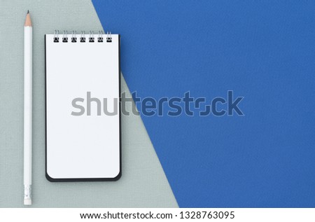 space pencil with note book background