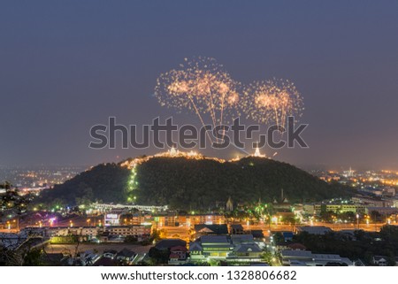 Fireworks sparkling on temples over the hills at Phra Nakhon Khiri, Khao Wang, Phetchaburi, Thailand.