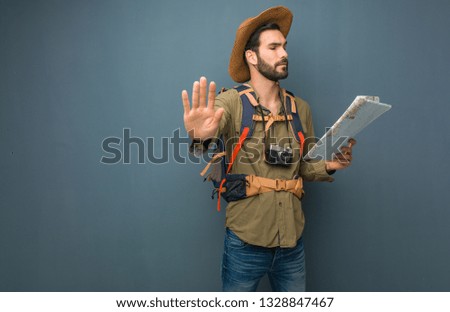 Traveler man putting hand in front